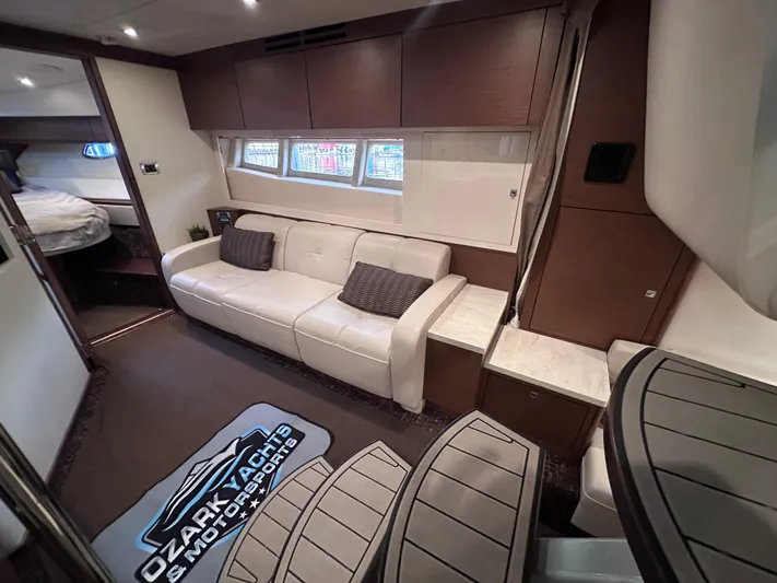  Yacht Photos Pics Interior of 2013 Sea Ray 410 Sundancer yacht with white sofa and modern design.