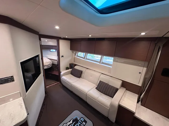  Yacht Photos Pics Luxurious interior of 2013 Sea Ray 410 Sundancer yacht with modern furnishings and natural light.