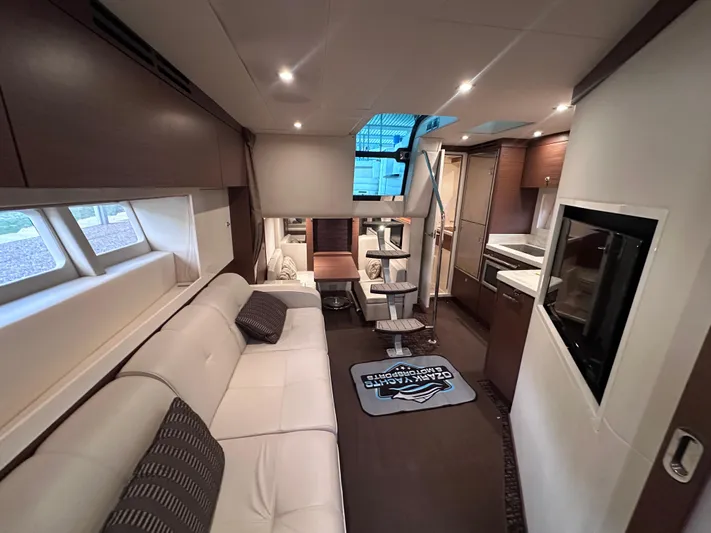  Yacht Photos Pics Luxurious interior of 2013 Sea Ray 410 Sundancer yacht with modern furnishings and elegant design.