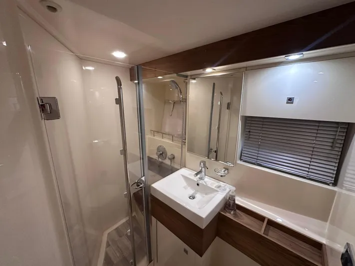  Yacht Photos Pics Luxurious bathroom interior of 2013 Sea Ray 410 Sundancer yacht with modern fixtures.