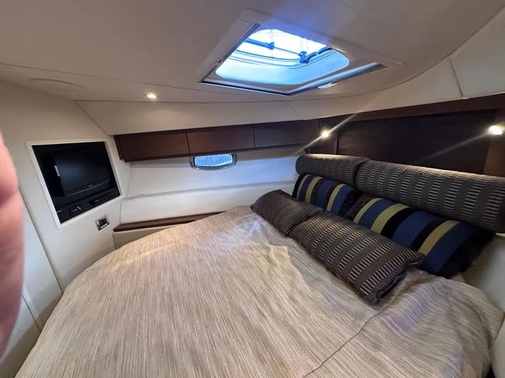  Yacht Photos Pics Luxurious cabin interior of 2013 Sea Ray 410 Sundancer yacht with skylight and TV.