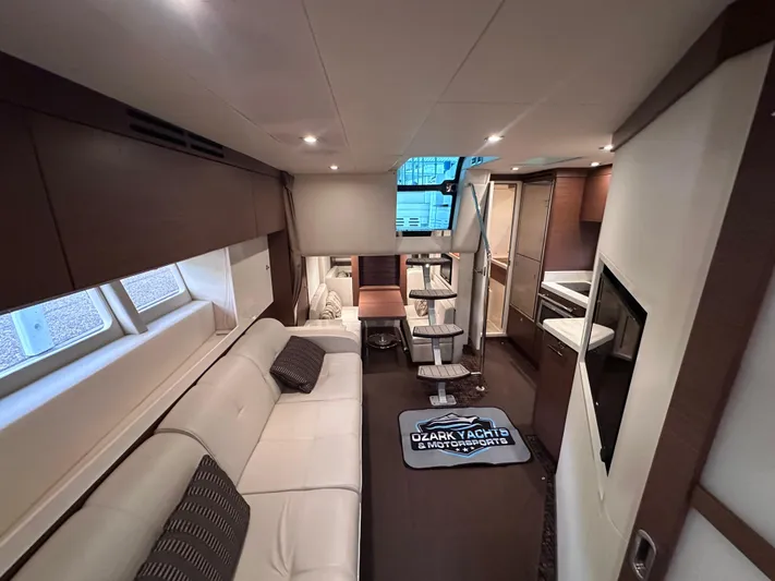  Yacht Photos Pics Luxurious interior of 2013 Sea Ray 410 Sundancer yacht with modern furnishings and kitchen.