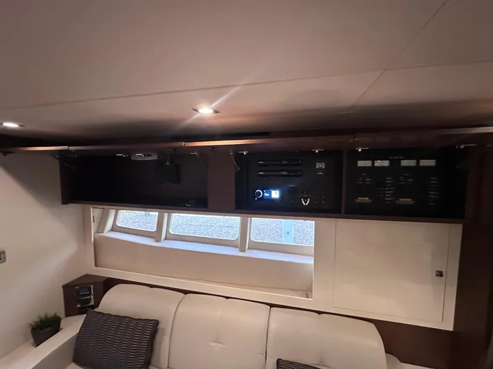  Yacht Photos Pics Interior of 2013 Sea Ray 410 Sundancer yacht with control panel and seating area.