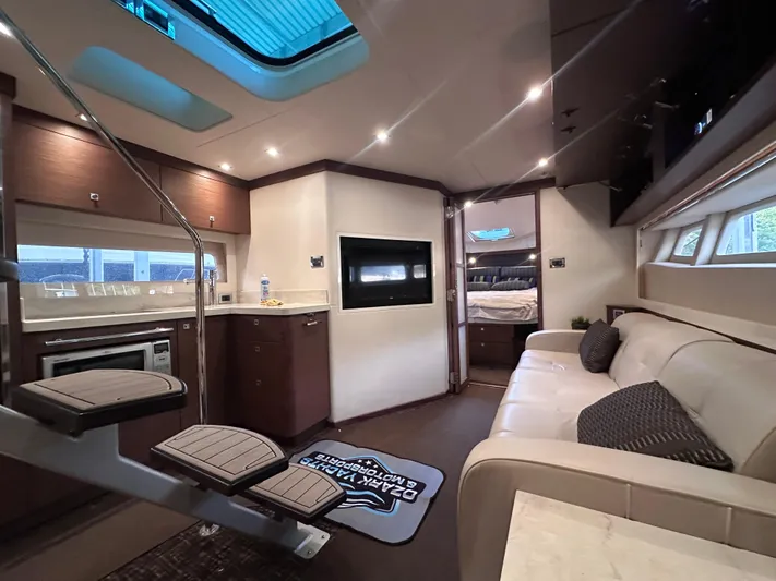  Yacht Photos Pics Luxurious interior of 2013 Sea Ray 410 Sundancer yacht with modern amenities and elegant design.