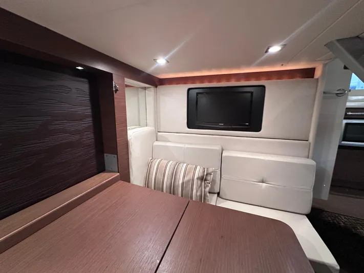  Yacht Photos Pics Luxurious interior of 2013 Sea Ray 410 Sundancer yacht with modern seating and TV.