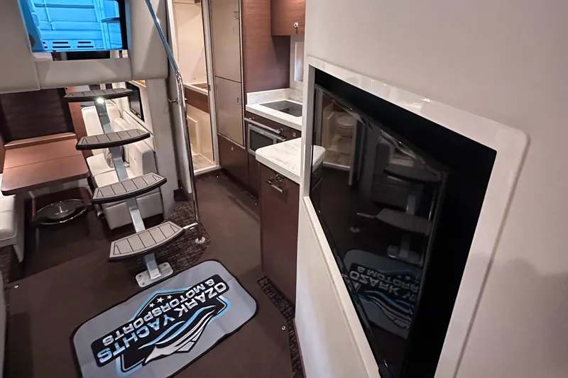  Yacht Photos Pics Interior of 2013 Sea Ray 410 Sundancer yacht with modern kitchen and seating area.