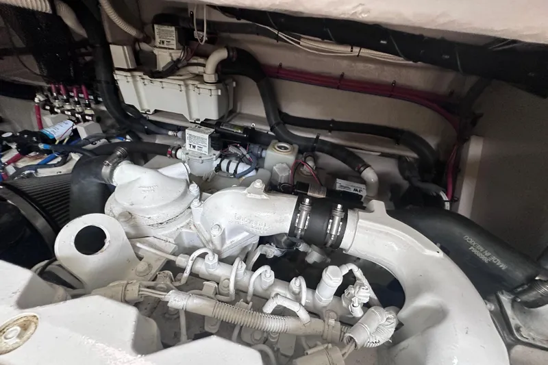  Yacht Photos Pics Engine compartment of a 2013 Sea Ray 410 Sundancer boat, showcasing mechanical components.