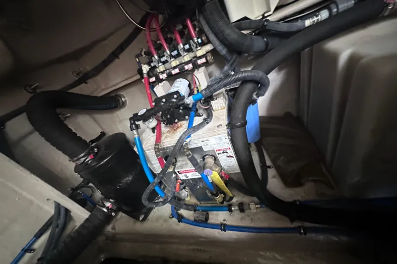  Yacht Photos Pics Engine compartment of 2013 Sea Ray 410 Sundancer with hoses and mechanical components.