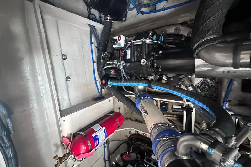  Yacht Photos Pics Engine room of 2013 Sea Ray 410 Sundancer with visible fire extinguisher and mechanical components.
