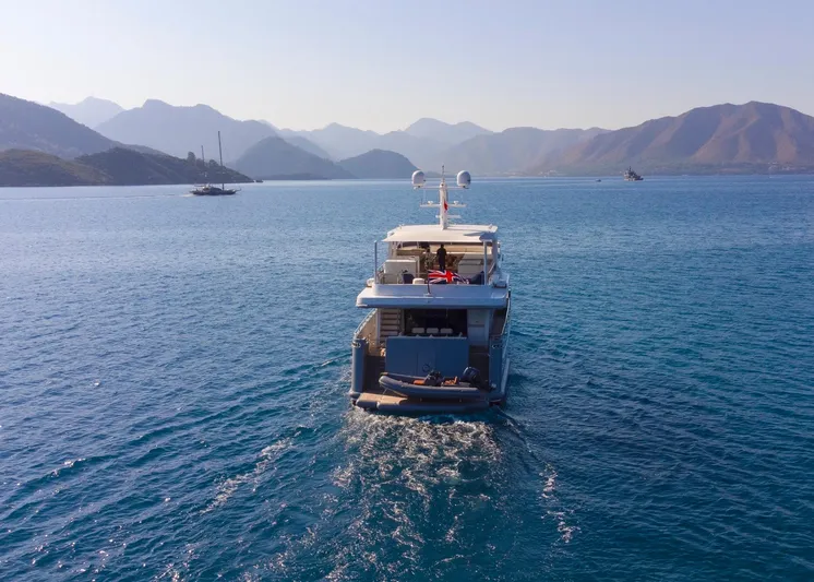  Yacht Photos Pics Custom 85 Semi Displacement Trawler cruising in scenic waters, 2022 model.