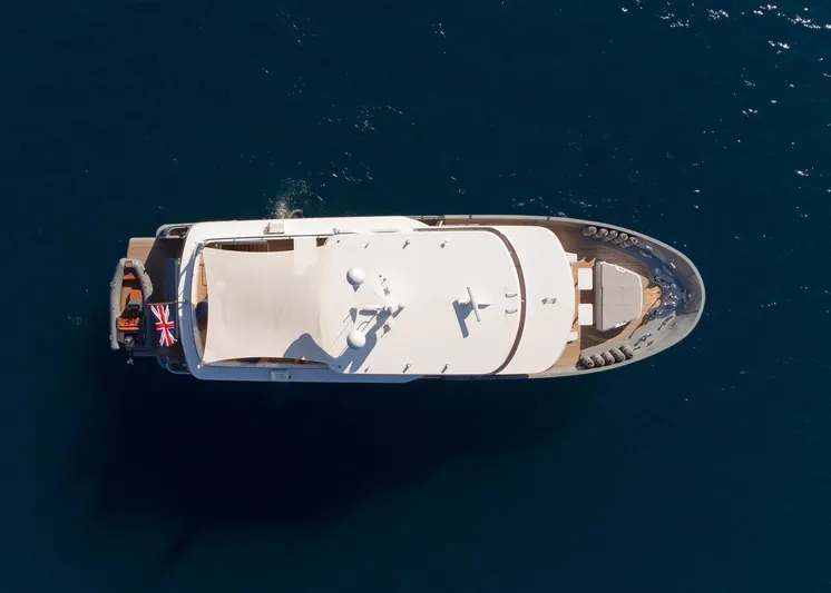  Yacht Photos Pics Aerial view of 2022 Custom 85 Semi Displacement Trawler on open water.