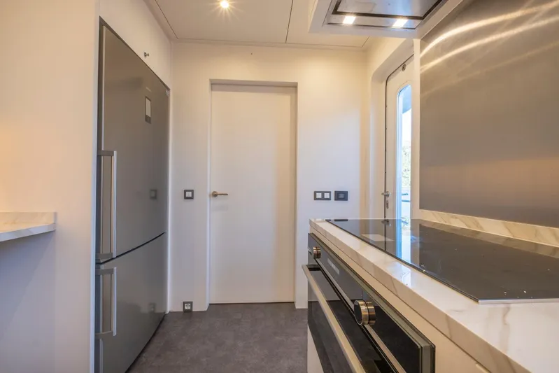  Yacht Photos Pics Modern kitchen interior on 2022 Custom 85 Semi Displacement Trawler yacht.