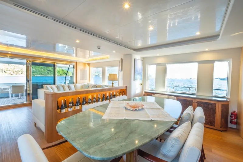  Yacht Photos Pics Luxurious interior of 2022 Custom 85 Semi Displacement Trawler with elegant dining area and scenic views.