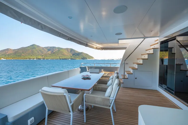  Yacht Photos Pics Luxurious 2022 Custom 85 Semi Displacement Trawler yacht deck with scenic ocean view.