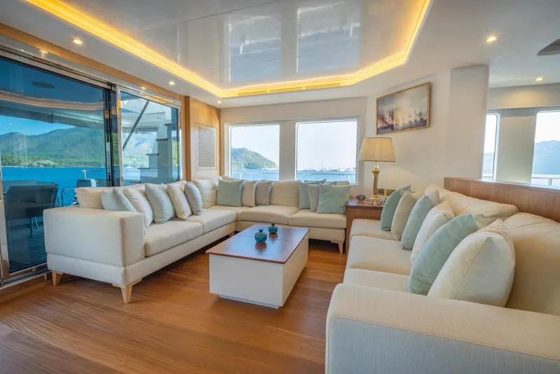  Yacht Photos Pics Luxurious interior of 2022 Custom 85 Semi Displacement Trawler with elegant seating and scenic views.