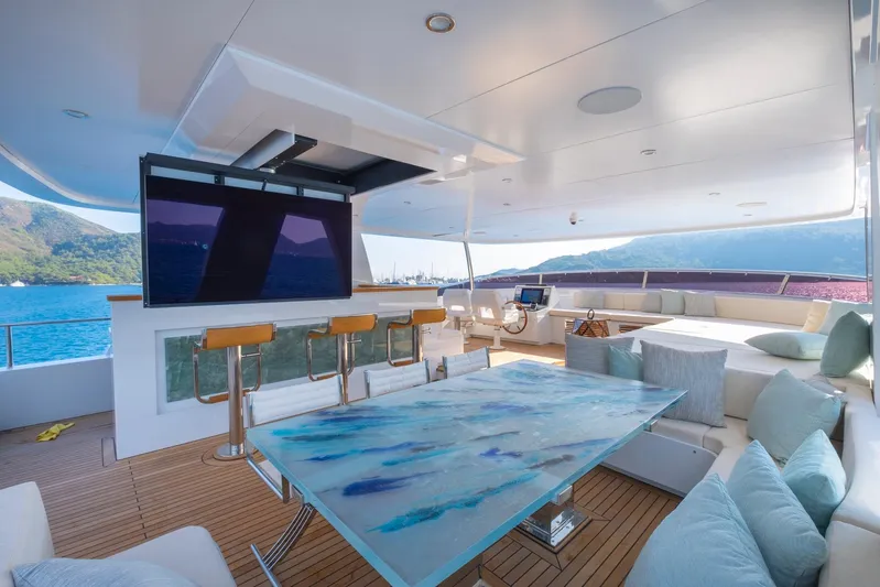  Yacht Photos Pics Luxurious 2022 Custom 85 Trawler yacht interior with modern seating, bar, and ocean view.