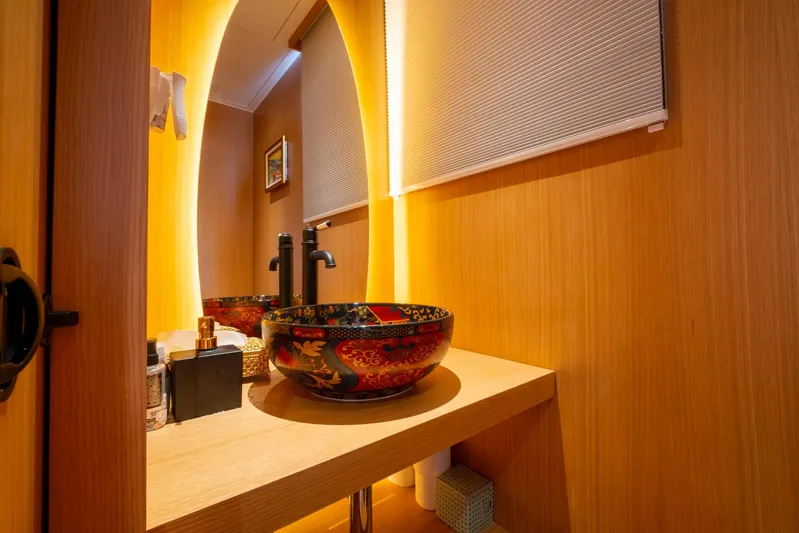  Yacht Photos Pics Luxurious bathroom with ornate sink on 2022 Custom 85 Semi Displacement Trawler yacht.