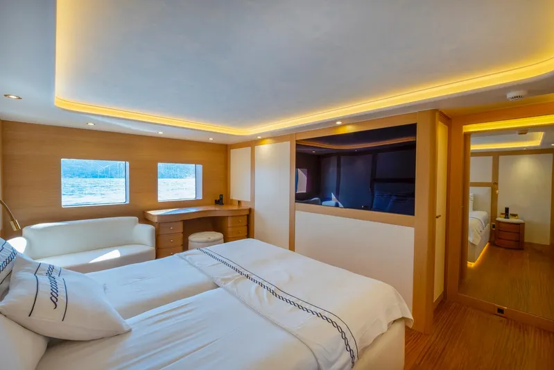  Yacht Photos Pics Luxurious bedroom interior of 2022 Custom 85 Semi Displacement Trawler with modern design and ambient lighting.