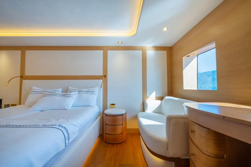  Yacht Photos Pics Luxurious bedroom interior on 2022 Custom 85 Semi Displacement Trawler yacht, featuring modern design.