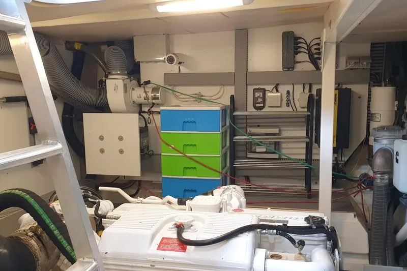 Jamap Yacht Photos Pics Engine room of 2016 Prestige 550 Fly yacht with organized equipment and storage.