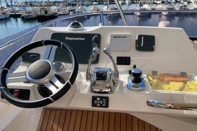 Jamap Yacht Photos Pics Helm of 2016 Prestige 550 Fly yacht with Raymarine navigation system.