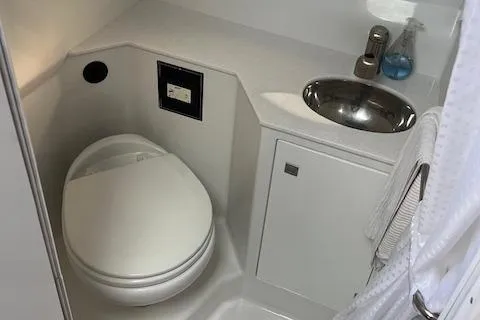  Yacht Photos Pics 2021 Monterey 295 Sport Yacht bathroom with toilet and sink.