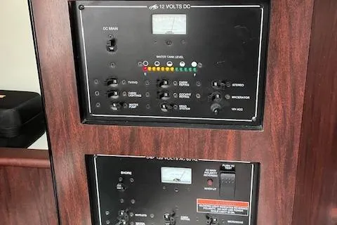  Yacht Photos Pics Control panel of 2021 Monterey 295 Sport Yacht, featuring switches and gauges.