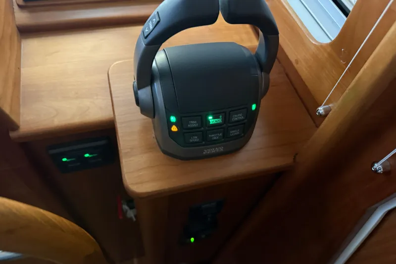 Bad Dog Yacht Photos Pics Control panel of 2021 Sabre 42 Fly Bridge yacht with illuminated buttons.