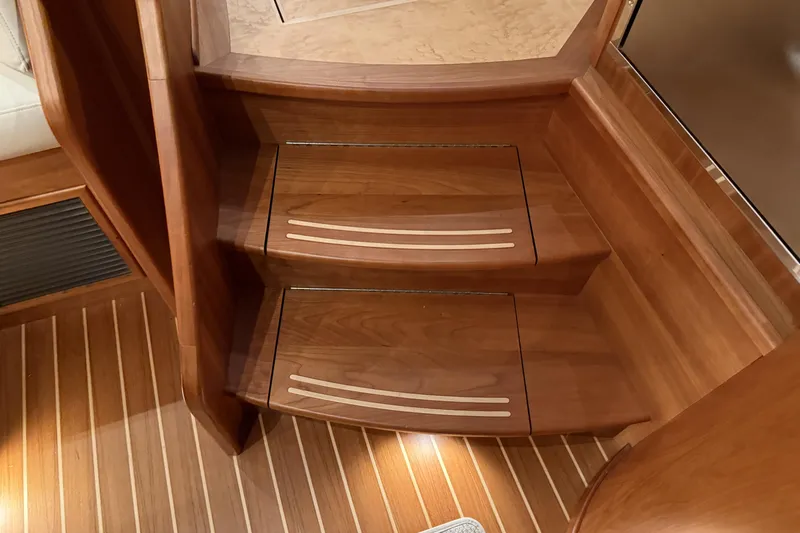 Bad Dog Yacht Photos Pics Wooden interior stairs on a 2021 Sabre 42 Fly Bridge yacht.