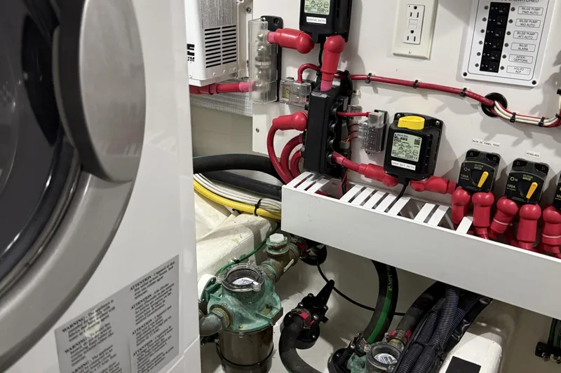 Bad Dog Yacht Photos Pics Engine room of 2021 Sabre 42 Fly Bridge with electrical components and wiring.