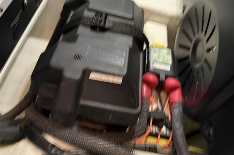 Bad Dog Yacht Photos Pics Engine compartment of 2021 Sabre 42 Fly Bridge with battery and wiring.