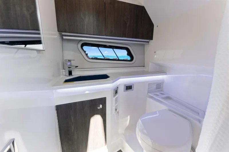 Yacht Photos Pics 2024 Formula 380 Super Sport Crossover bathroom with modern fixtures and sleek design.