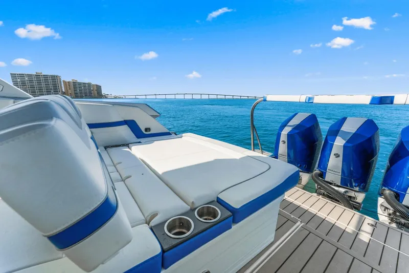  Yacht Photos Pics 2024 Formula 380 Super Sport Crossover boat with triple engines on a sunny day.