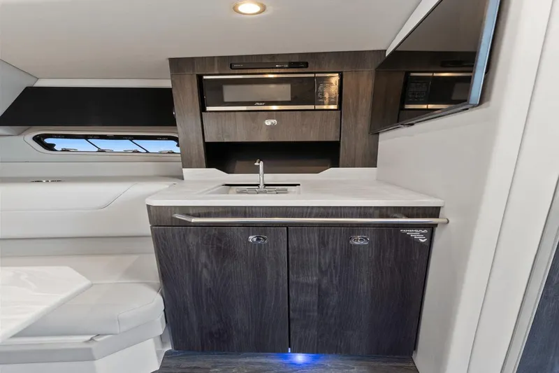  Yacht Photos Pics 2024 Formula 380 Super Sport Crossover interior with modern kitchenette and sleek design.