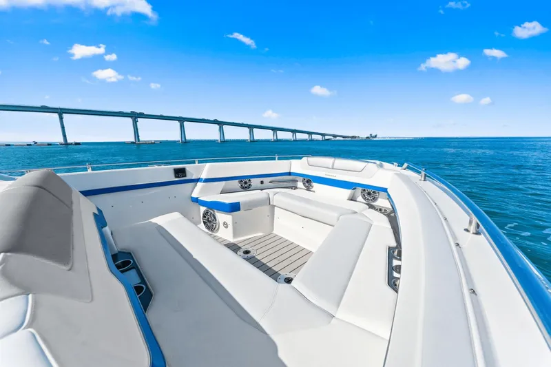  Yacht Photos Pics 2024 Formula 380 Super Sport Crossover boat on open water with bridge view.