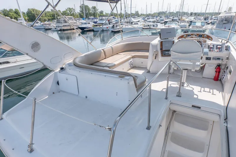  Yacht Photos Pics 2001 Bayliner 3788 Command Bridge Motoryacht with spacious deck and marina view.