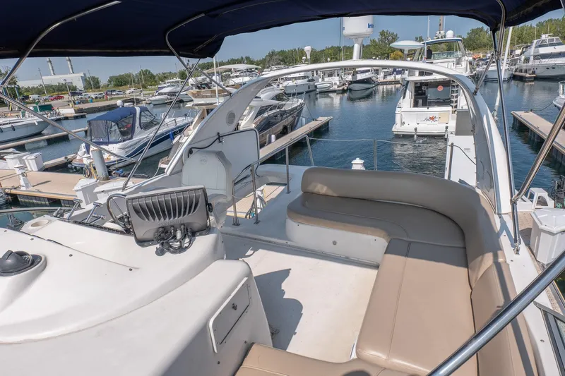  Yacht Photos Pics 2001 Bayliner 3788 Command Bridge Motoryacht at marina, featuring spacious seating and helm.