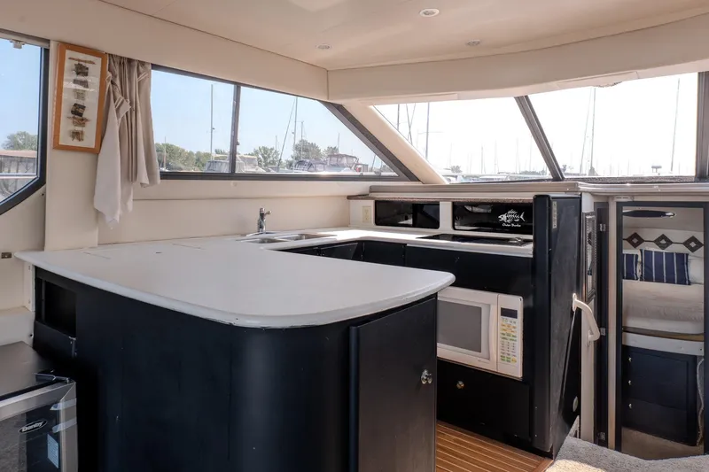  Yacht Photos Pics Interior of 2001 Bayliner 3788 Command Bridge Motoryacht with modern kitchen amenities.