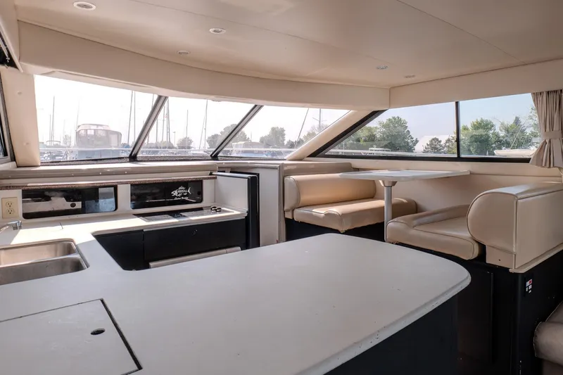  Yacht Photos Pics Interior of 2001 Bayliner 3788 Command Bridge Motoryacht with spacious seating and large windows.