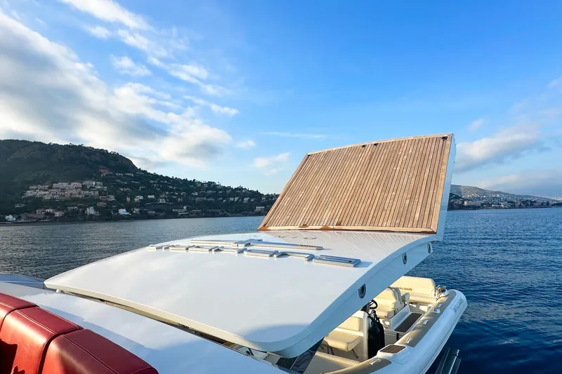 Euphoria II Yacht Photos Pics Luxurious Mayra Yachts 50m, 2016 model, cruising near scenic coastline under blue skies.