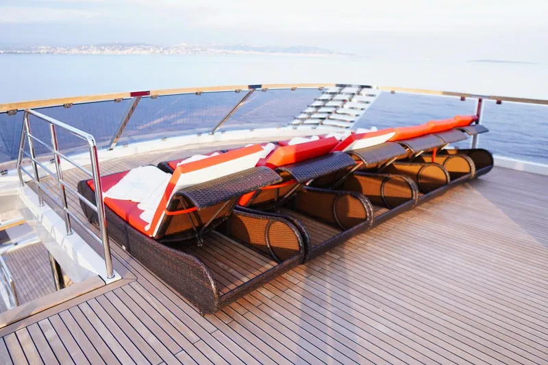 Euphoria II Yacht Photos Pics Sun loungers on the deck of a 2016 Mayra Yachts 50m, overlooking the sea.