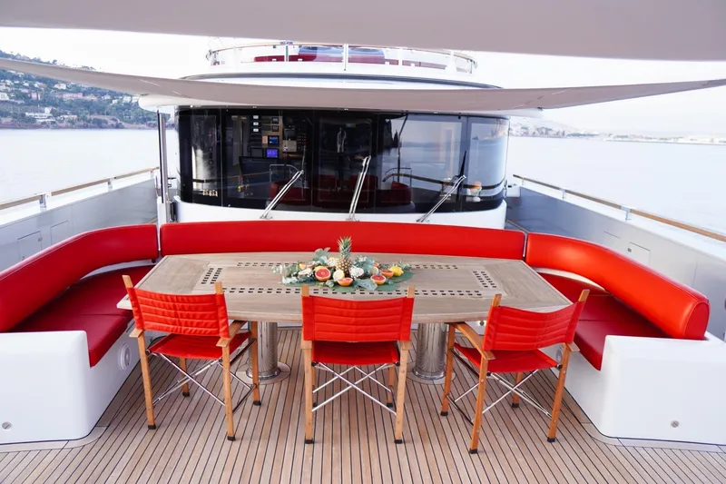 Euphoria II Yacht Photos Pics Luxurious Mayra Yachts 50m deck with red seating and elegant dining setup, 2016 model.