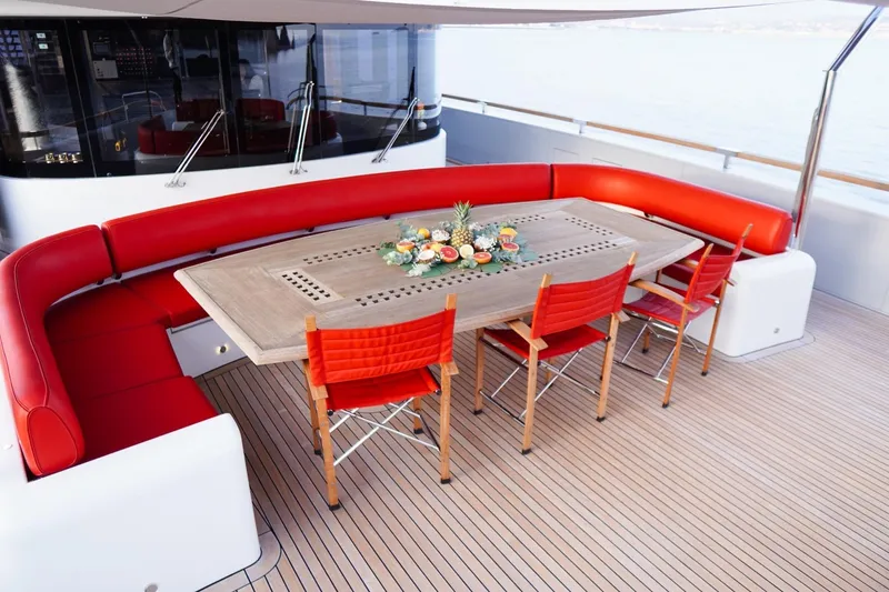 Euphoria II Yacht Photos Pics Luxurious Mayra Yachts 50m deck with red seating and elegant dining setup, 2016 model.