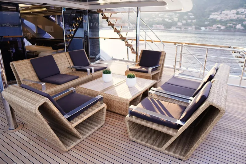 Euphoria II Yacht Photos Pics Luxurious outdoor seating on 2016 Mayra Yachts 50m, featuring wicker furniture and ocean views.