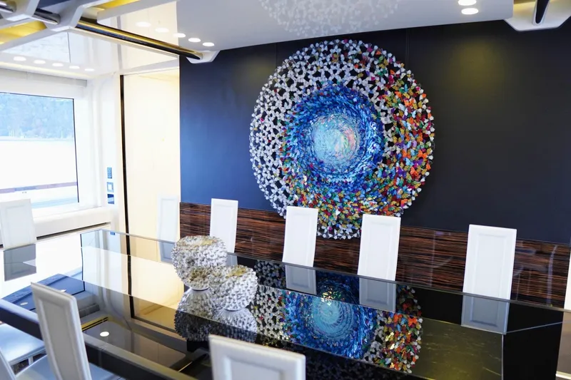 Euphoria II Yacht Photos Pics Luxurious dining area on 2016 Mayra Yachts 50m, featuring modern art and elegant decor.