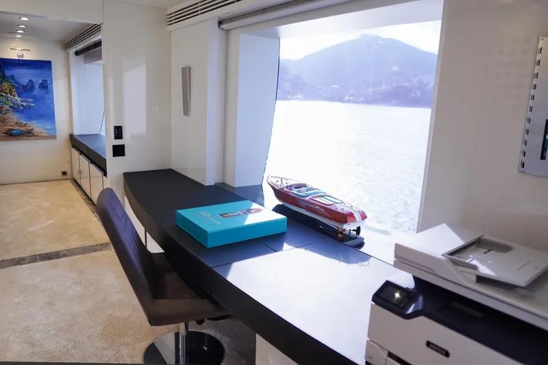 Euphoria II Yacht Photos Pics Luxurious Mayra Yachts 50m interior with scenic ocean view, model yacht, and modern decor.