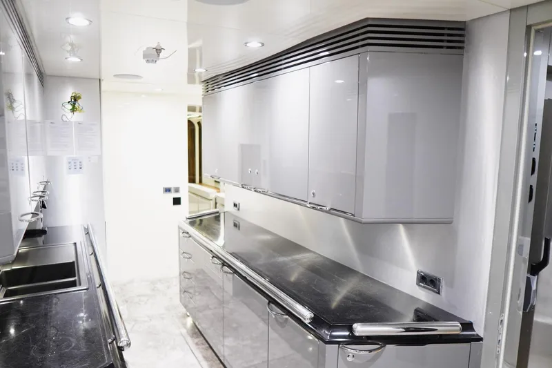 Euphoria II Yacht Photos Pics Luxurious galley kitchen on 2016 Mayra Yachts 50m, featuring sleek cabinetry and modern design.