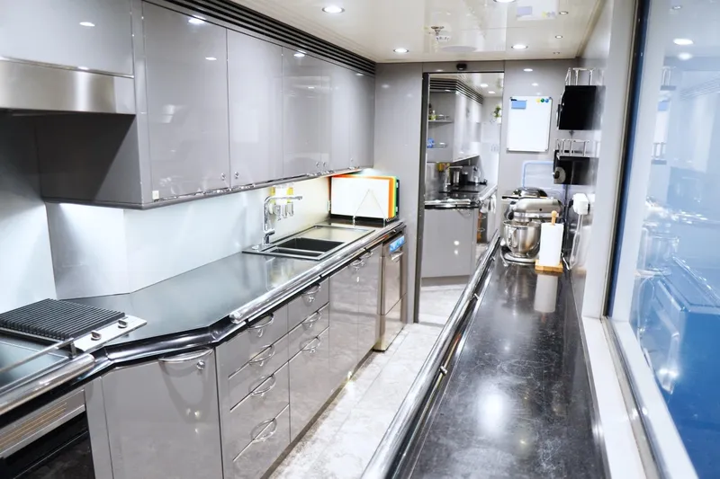 Euphoria II Yacht Photos Pics Luxurious kitchen interior on a 2016 Mayra Yachts 50m, featuring modern stainless steel appliances.