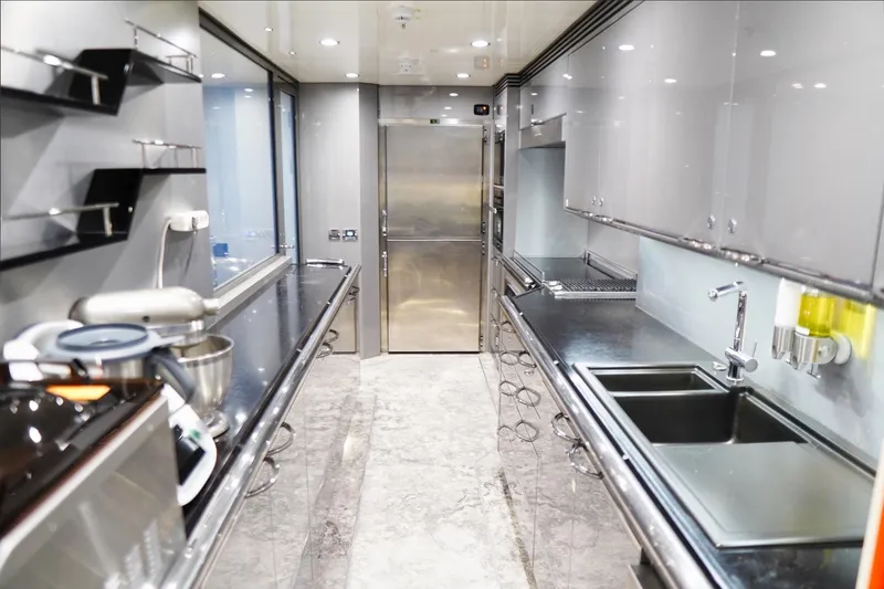Euphoria II Yacht Photos Pics Luxurious kitchen interior on 2016 Mayra Yachts 50m, featuring modern appliances and sleek design.