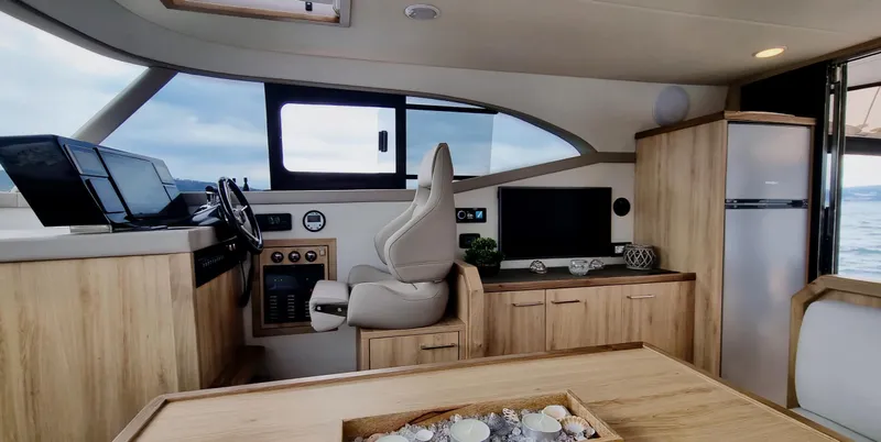 Monachus 470 Fly Yacht Photos Pics Luxurious interior of 2026 Monachus 470 FLY yacht with modern helm and amenities.